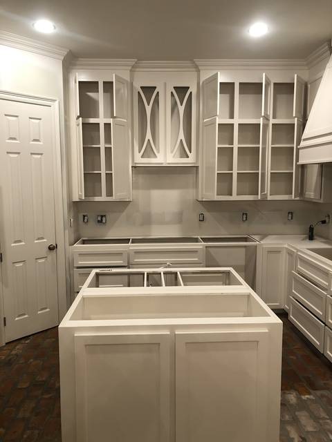 New-build cabinets sprayed white, before the countertops
